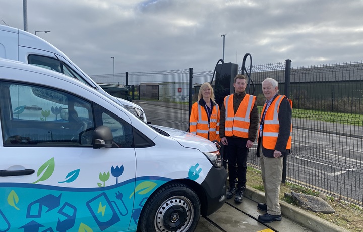 Cllr Kelly with staff next to an electric fleet van Cllr Kelly with staff next to an electric fleet van