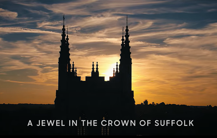 A jewel in the crown of Suffolk YouTube video Cathedral spire with sunset behind